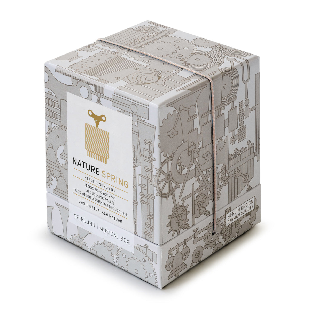 Geschenkverpackung der Spieluhr ‚Nature Spring‘ von Siebensachen, dekorative Schachtel mit technischen Linienzeichnungen und Produktetikett in Beige und Gold.