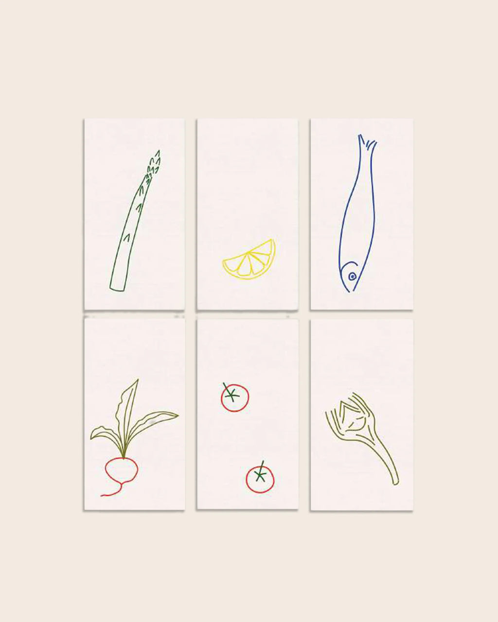 Handgestickte Leinenservietten DINER AU BISTROT von ŒUVRES SENSIBLES. Sechs Motive: Spargel, Zitrone, Fisch, Radieschen, Tomaten und Fenchel. 100 % Leinen, Made in France.