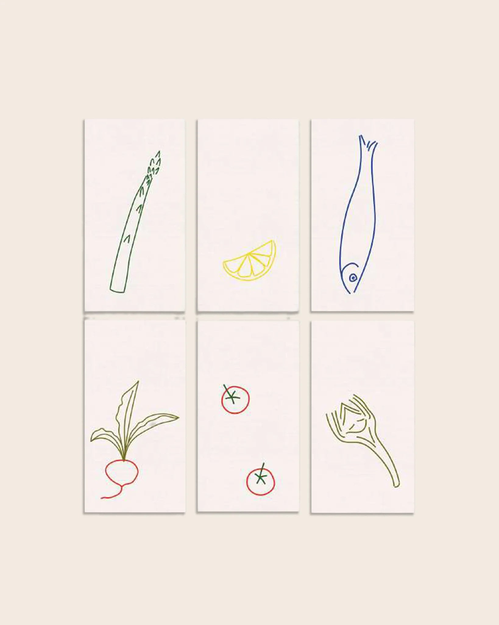 Handgestickte Leinenservietten DINER AU BISTROT von ŒUVRES SENSIBLES. Sechs Motive: Spargel, Zitrone, Fisch, Radieschen, Tomaten und Fenchel. 100 % Leinen, Made in France.