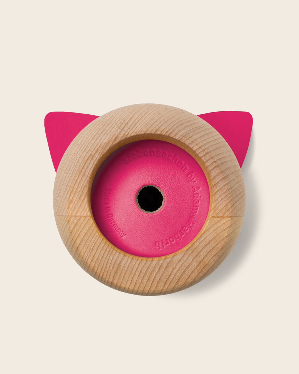 Unterseite der Spardose PINK LADY aus Buche mit pinken Lederboden und Prägung Siebensachen by Adam und Harborth. Handgefertigt Made in Germany.