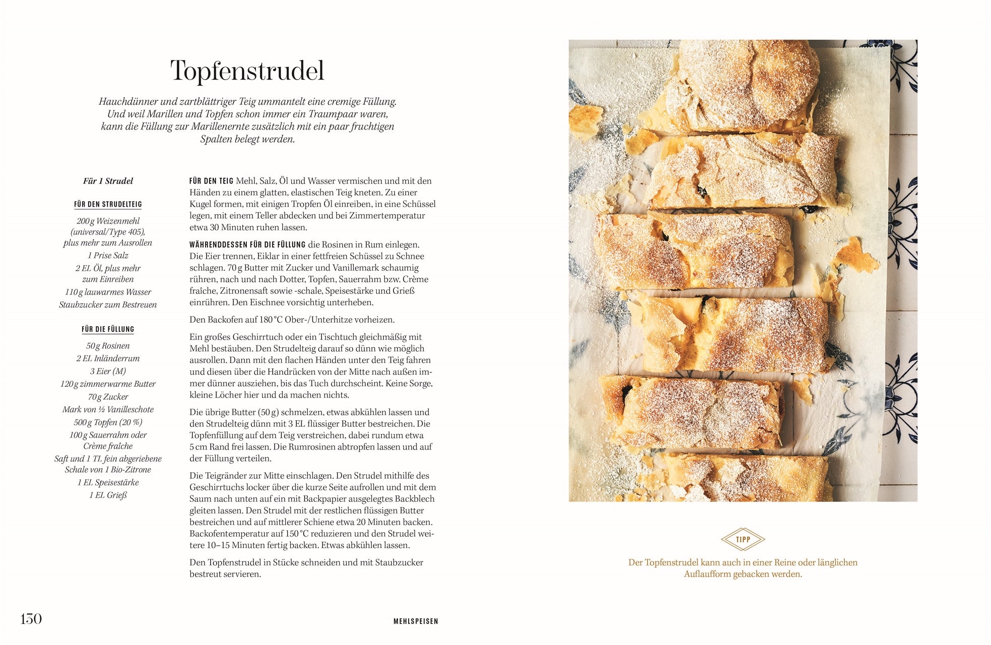 Rezept Topfenstrudel: Frisch gebackener Topfenstrudel auf Backpapier, in Stücke geschnitten, mit Staubzucker bestäubt; rustikale Optik auf gefliester Unterlage.