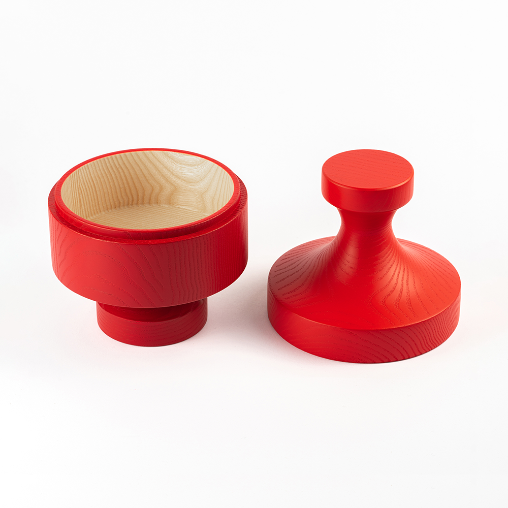 Design object ANUKI red by NIEVEN. Two-piece wooden bowl made of ash wood shown open modern design object with an organic form ideal as a jewelry box or storage bowl made in Germany.