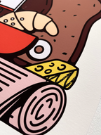 Detail view of the Fine Art Print Wiener Standard Frühstück by RadandYellow shows the precise printing and vibrant colors of the illustration with cheese croissant bread and newspaper. The high quality art print stands out with clean lines rich color application and fine texture on Fotospeed Art Smooth paper.